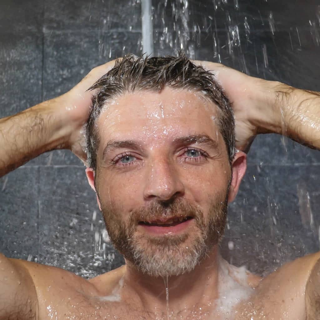 Man washing his hair with keratin shampoo